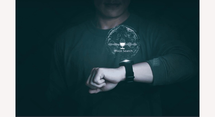 - Person using a smart speaker for voice search, representing the growing trend of voice search optimization in daily life